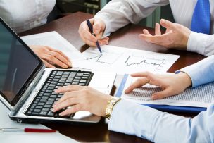 Image of three business peoples hands at working meeting